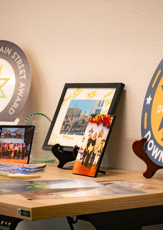 Display showcasing Downtown Denison’s tourism and Main Street awards