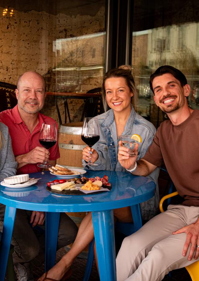 Family celebrating a birthday gathering at Landon Winery in Downtown Denison