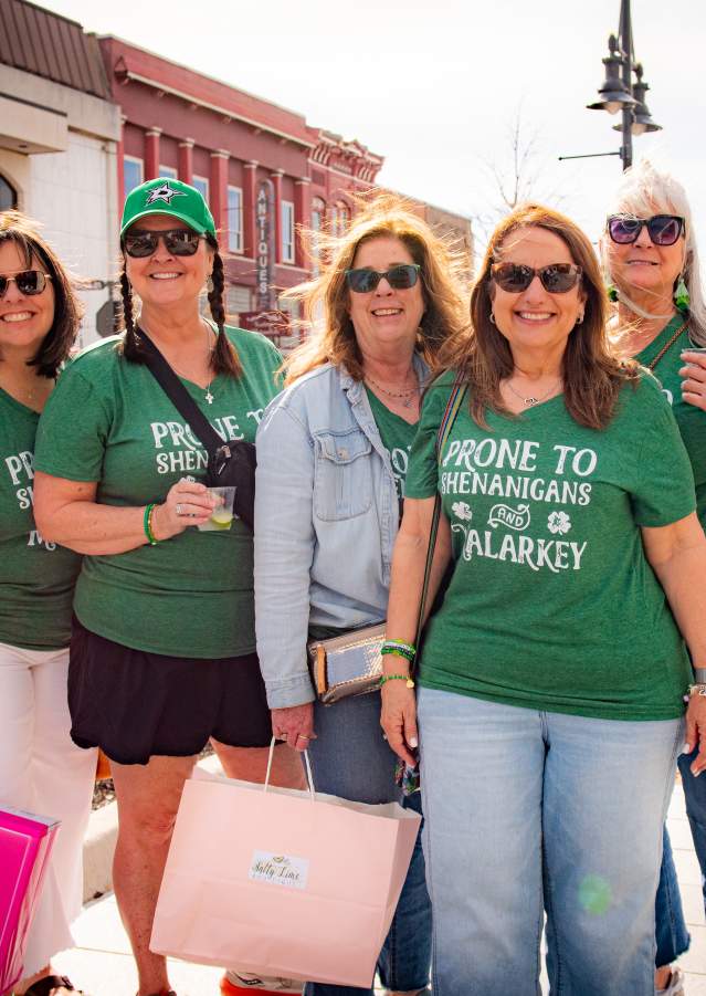 Group dressed in green celebrating St. Patrick’s Day in Downtown Denison