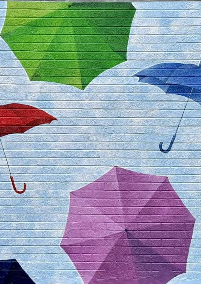 Antique Umbrella Alley mural by Matt Litchliter (2024)