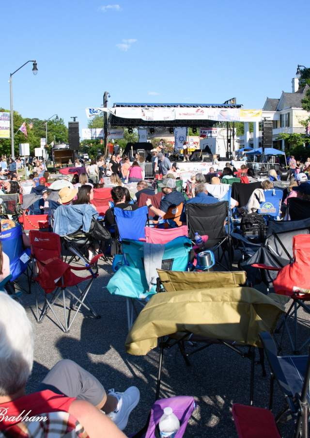 Visitors gather in downtown Nashville, North Carolina, during the annual Nashville Blooming Festival featuring live entertainment, vendors, and community activities.