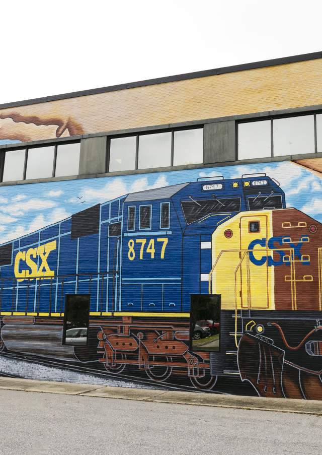 Colorful mural of a CSX train on a building in downtown Rocky Mount, North Carolina.
