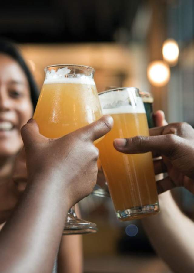 Visitors toasting drinks during a night out in Rocky Mount, NC