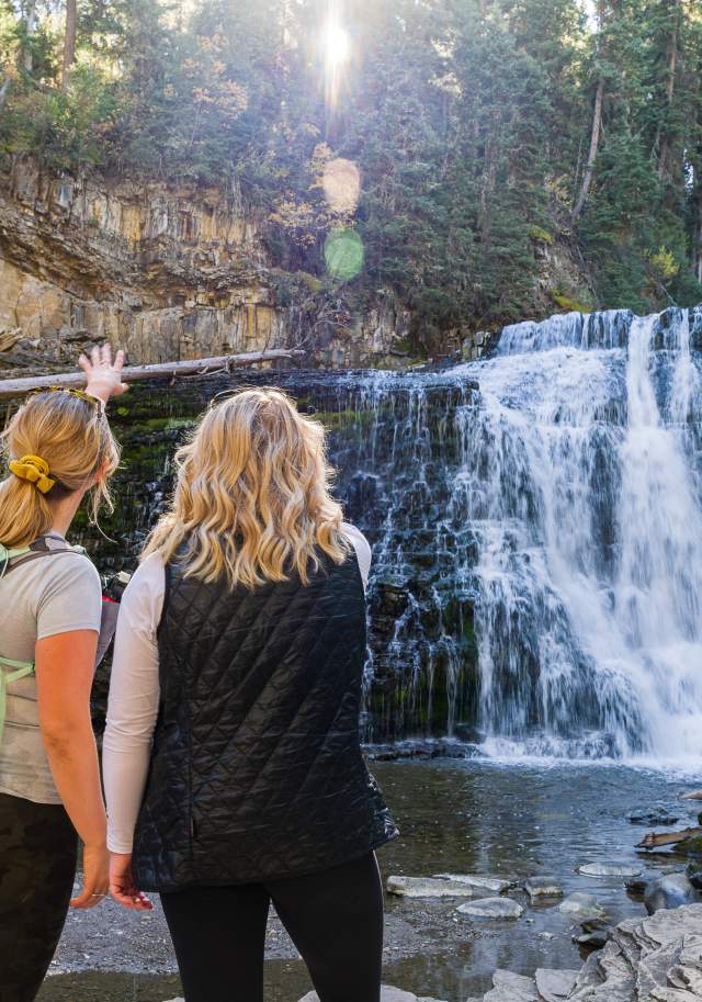 Two Girls looking at the Ousel Falls Waterfall