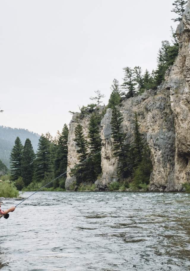 Woman fly-fishing in Big Sky