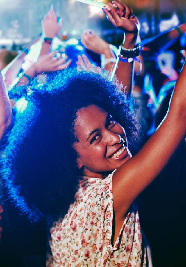 Woman smiling at concert