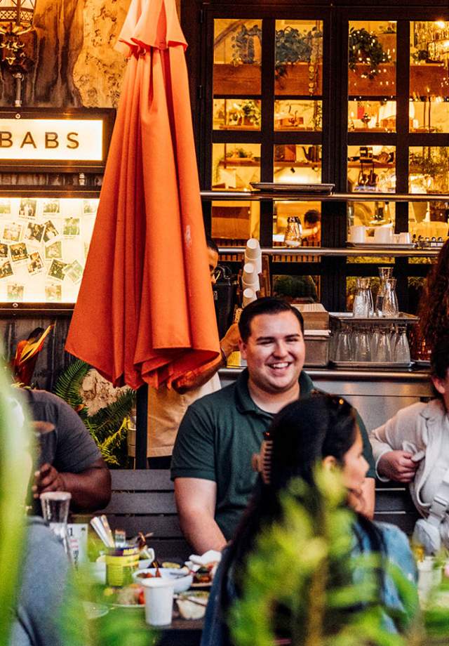 Mazra Restaurant exterior with people sitting outside