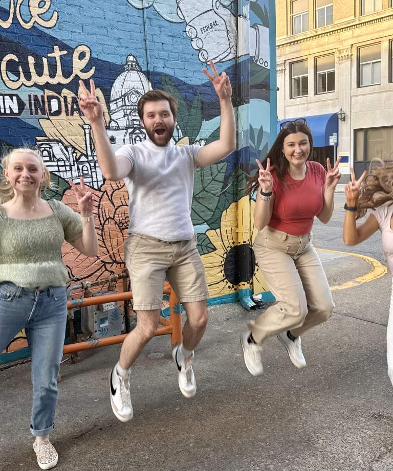 Young adults jumping