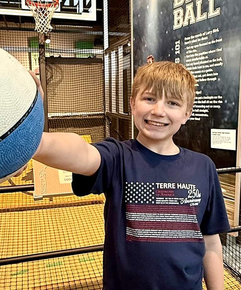 Boy with patriotic basketball at Larry Bird Museum