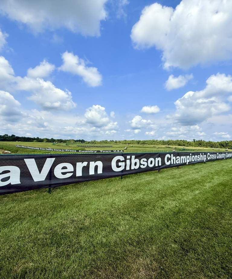 LaVern Gibson Championship with sign and grass