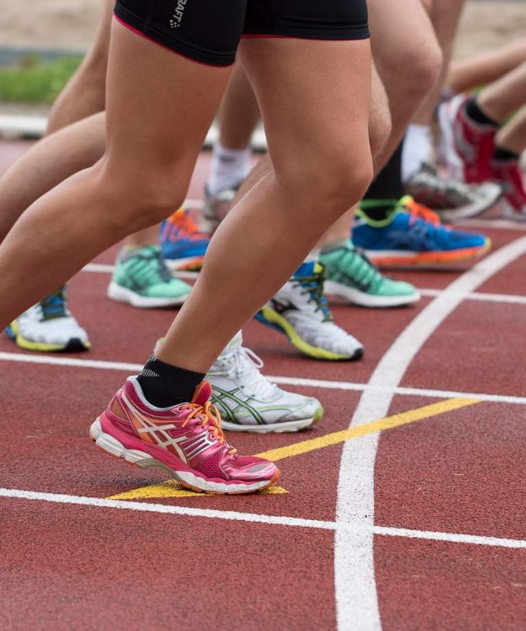 Runners feet on track, ready to start