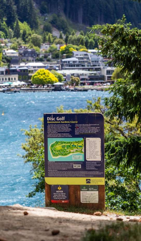 A landscape image of disc golf course in the Queenstown Gardens