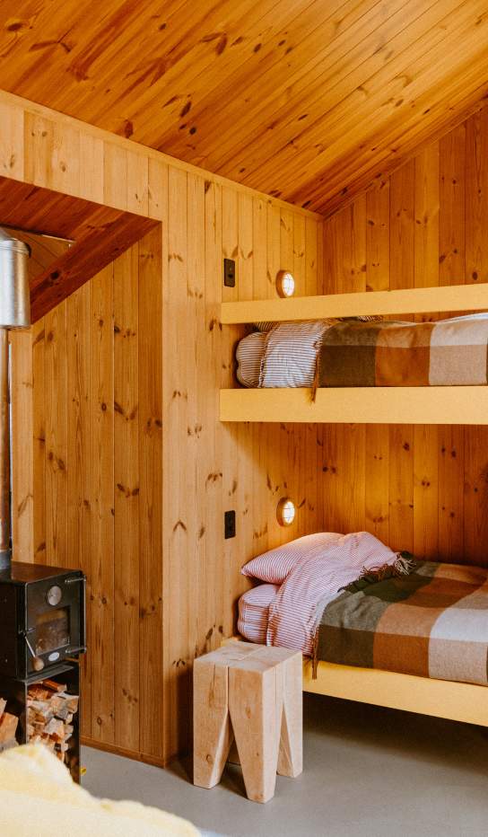Wood cabin with bunk beds accommodation at The Great Glenorchy Alpine Base Camp