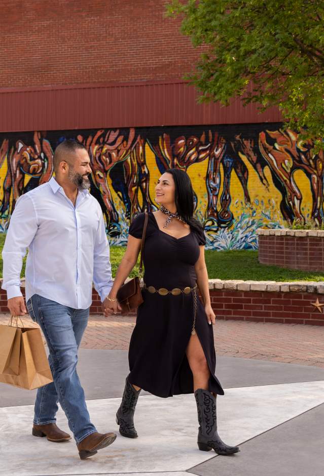 A couple walking at Pat Coursey Park