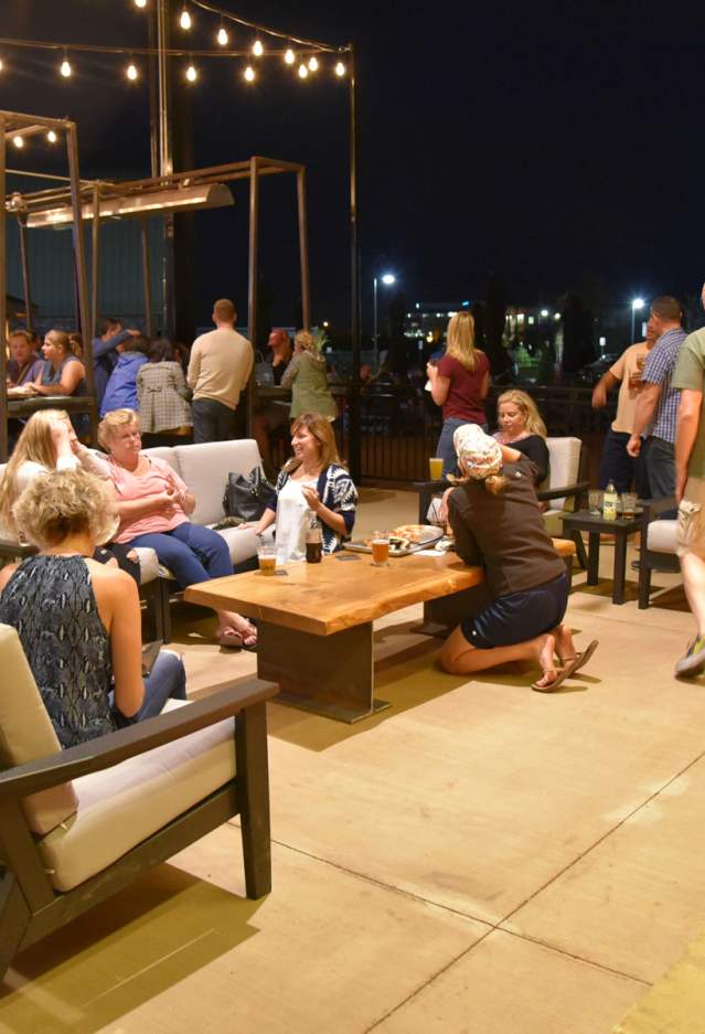 People sitting on a patio at night