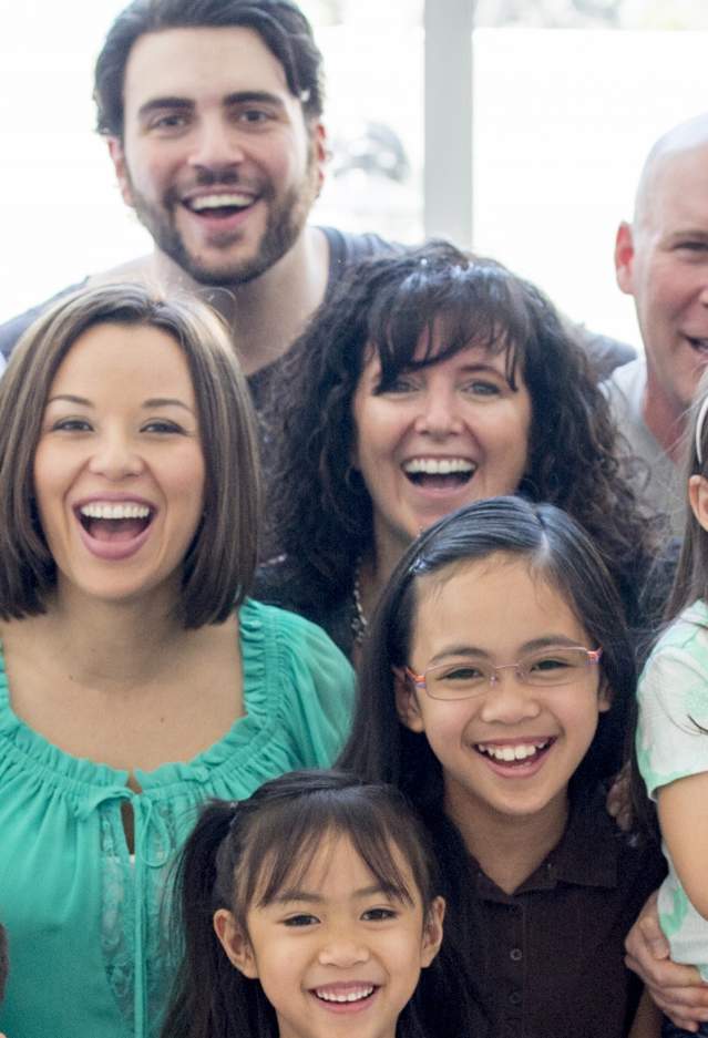 A diverse group of people smiling
