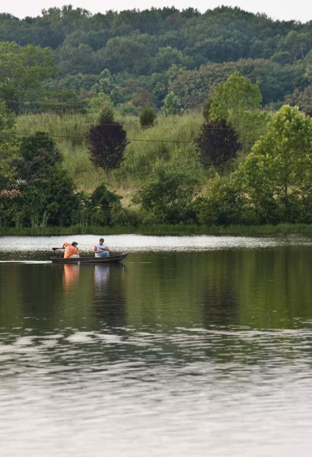 2 men fishing in a canoe at Silver Lake Regional Park