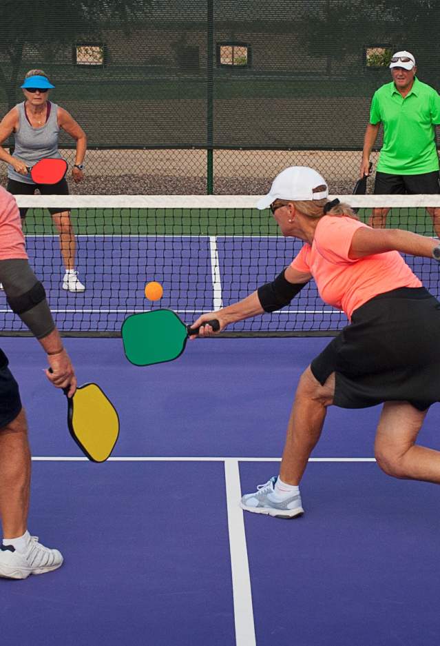 2 couples playing pickleball