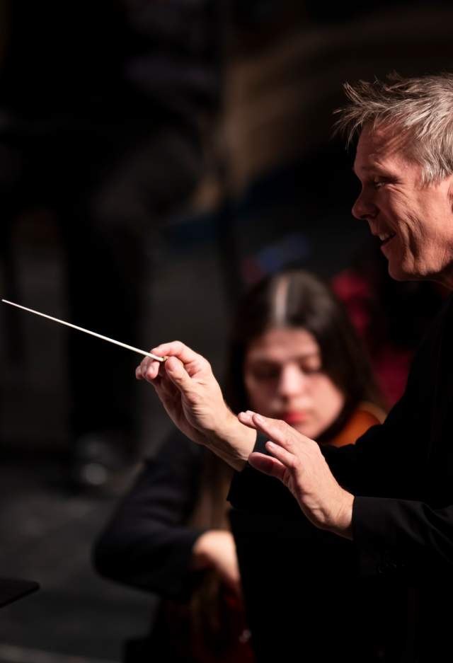 Conductor & Orchestra performing