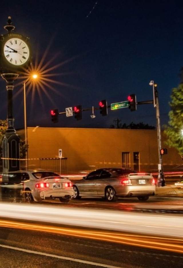 Cars driving around Edmond at night