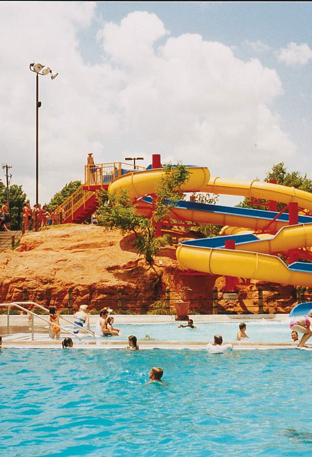 people enjoying water park and slides
