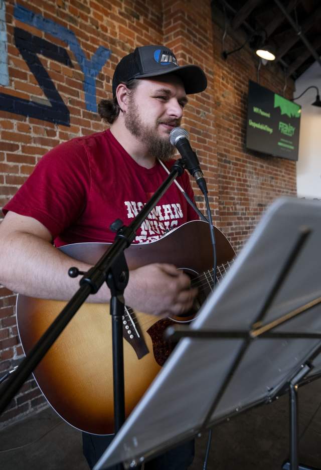 Man Playing guitar indoors
