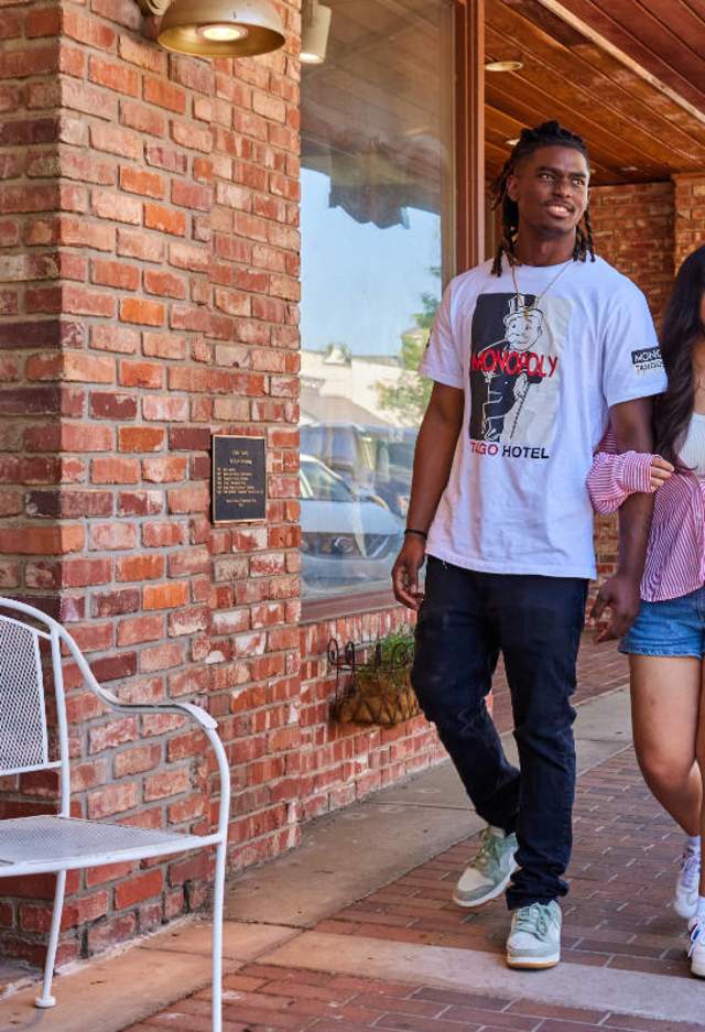 a group of friends walking by a shop