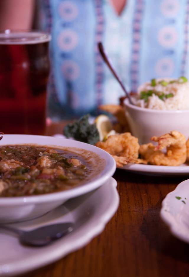 Tasty spread of gumbo, fish and shrimp dishes with local beer to wash it down