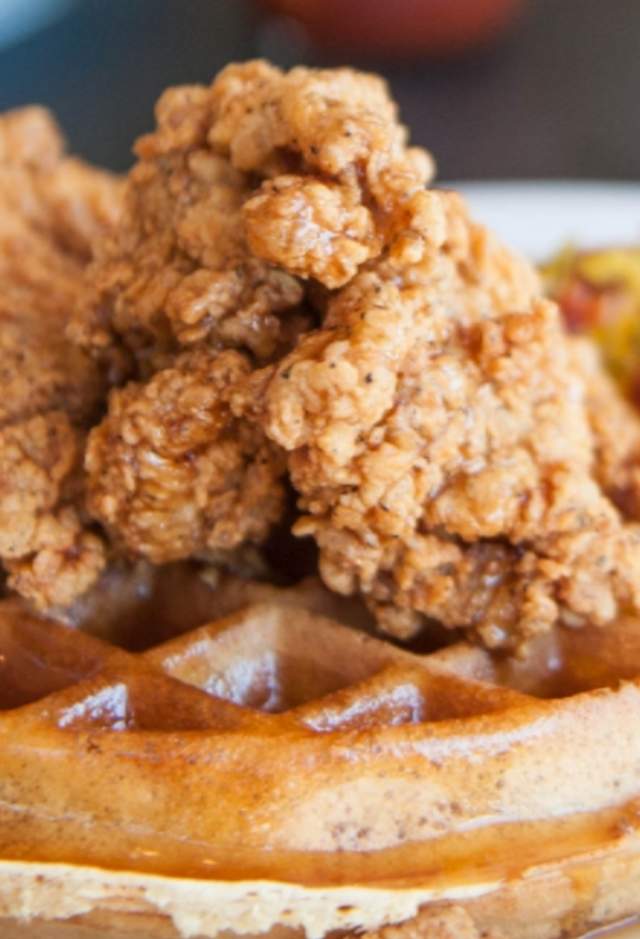 Delicious image of chicken & waffles with side of hash browns