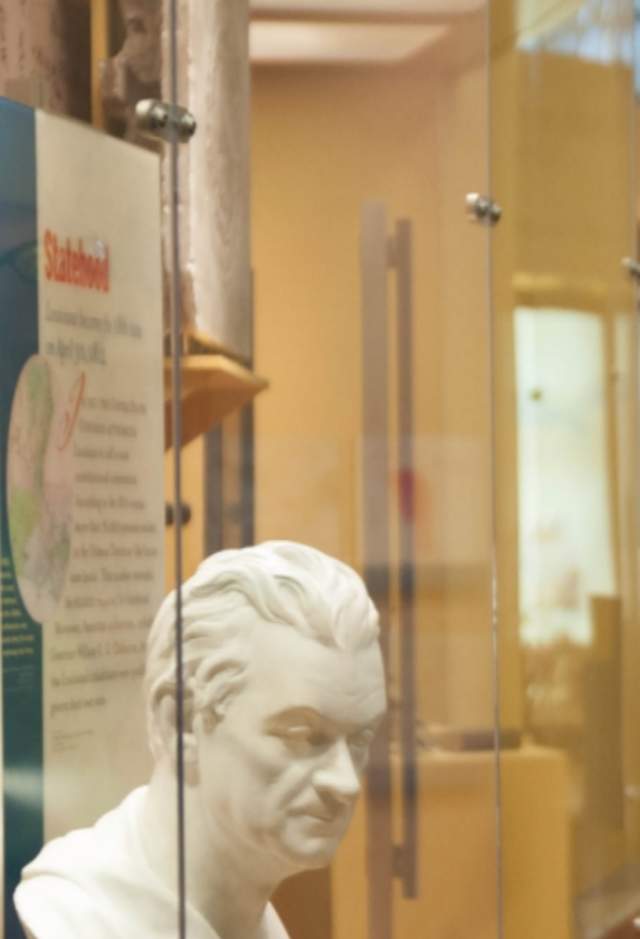 Man exploring museum as part of tour