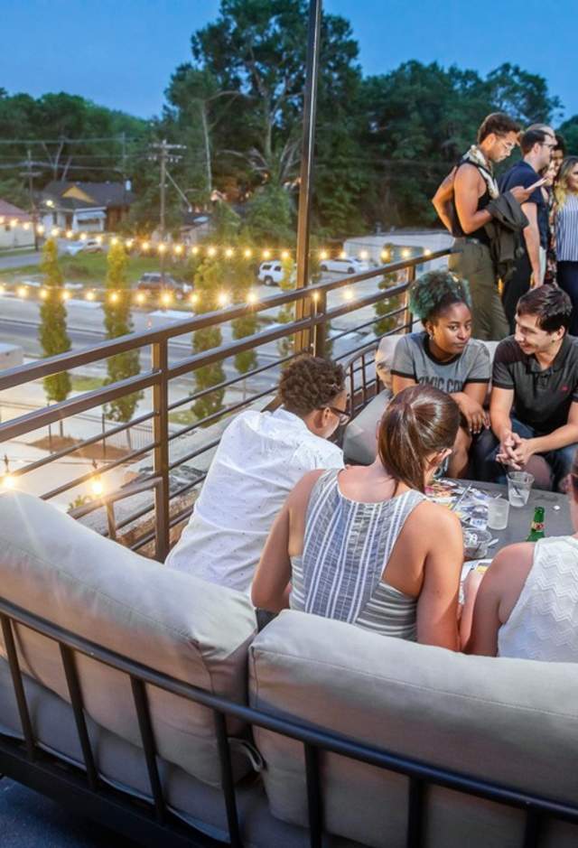 Group of people on the rooftop at Red Stick Social