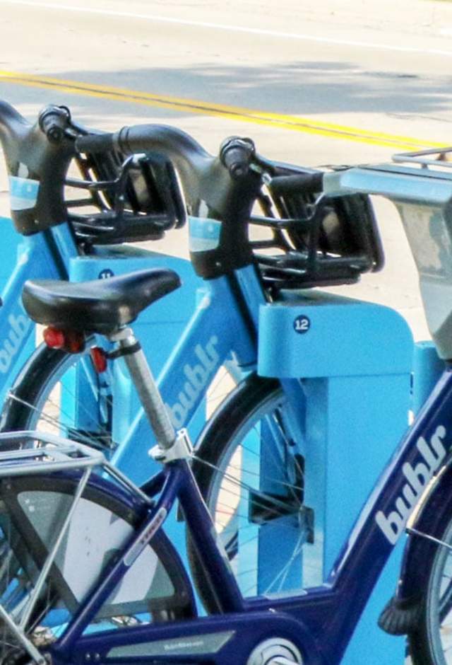 getting here bublr blue bikes lined up in docking station