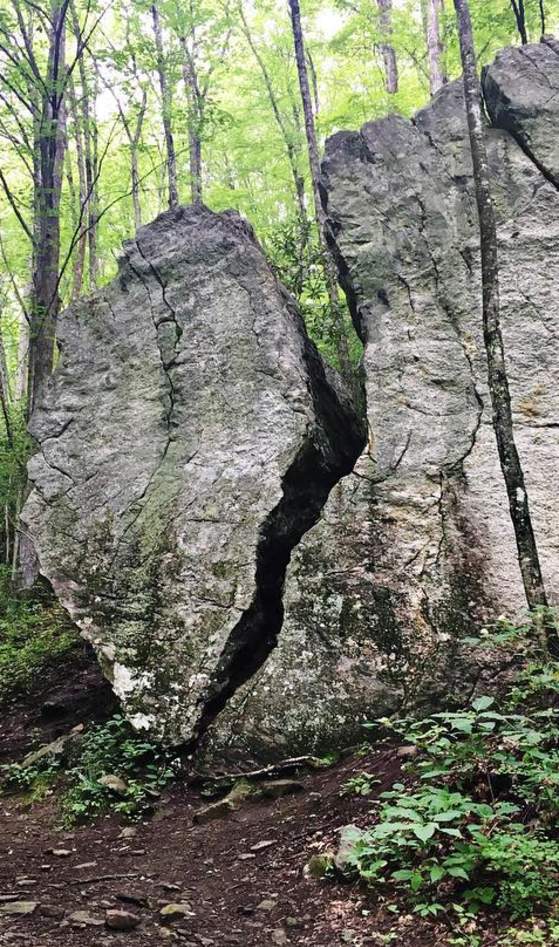 hiker near rock formation