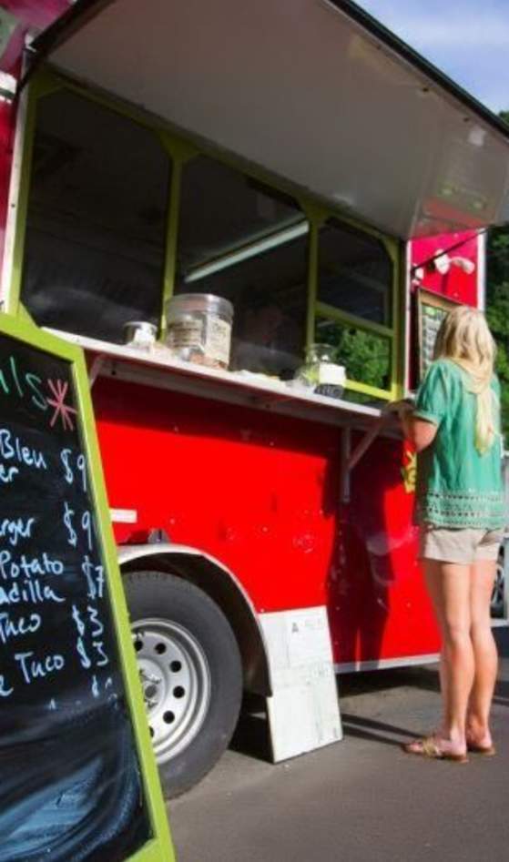 Woman ordering food from a food truck