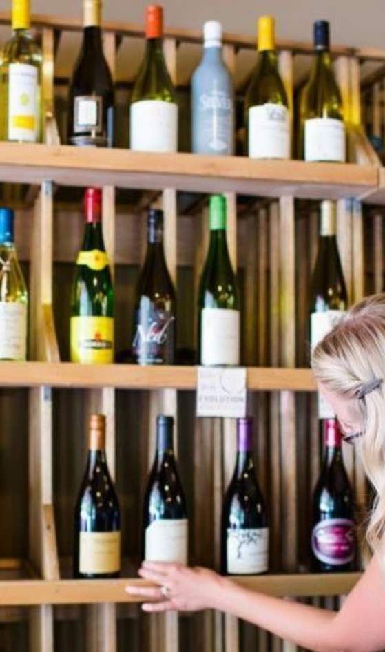 woman browsing wine rack