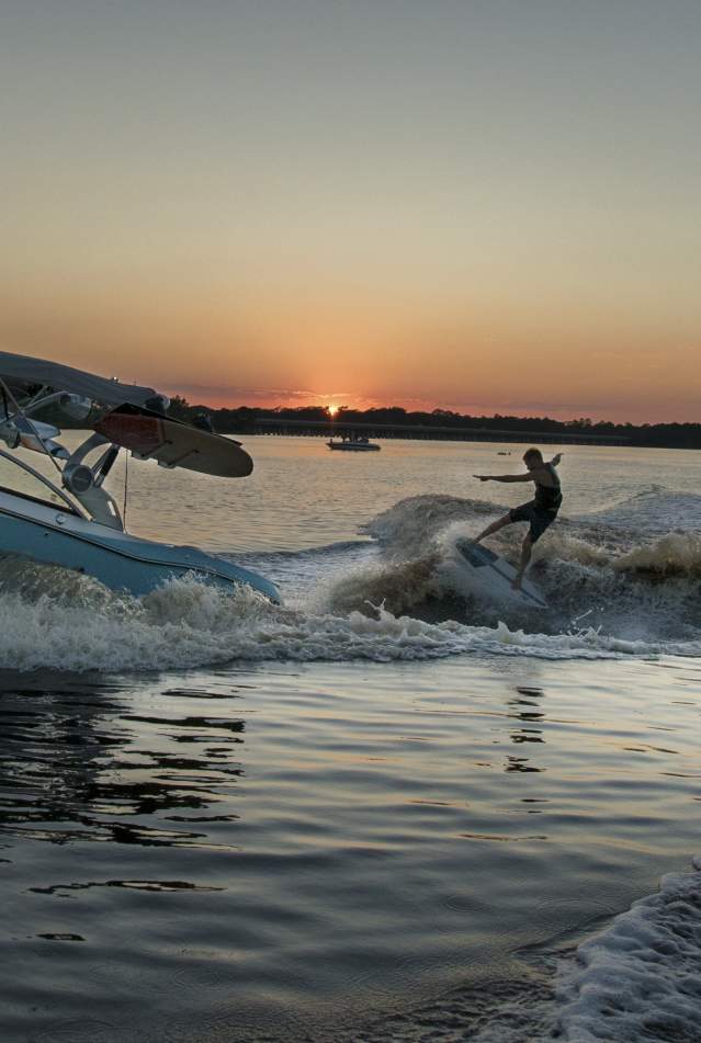 Man Wakeboarding Behind a Boat in Panama City Beach