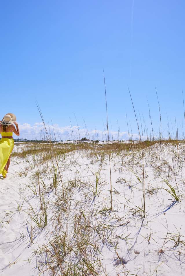 Girl walking on dunes