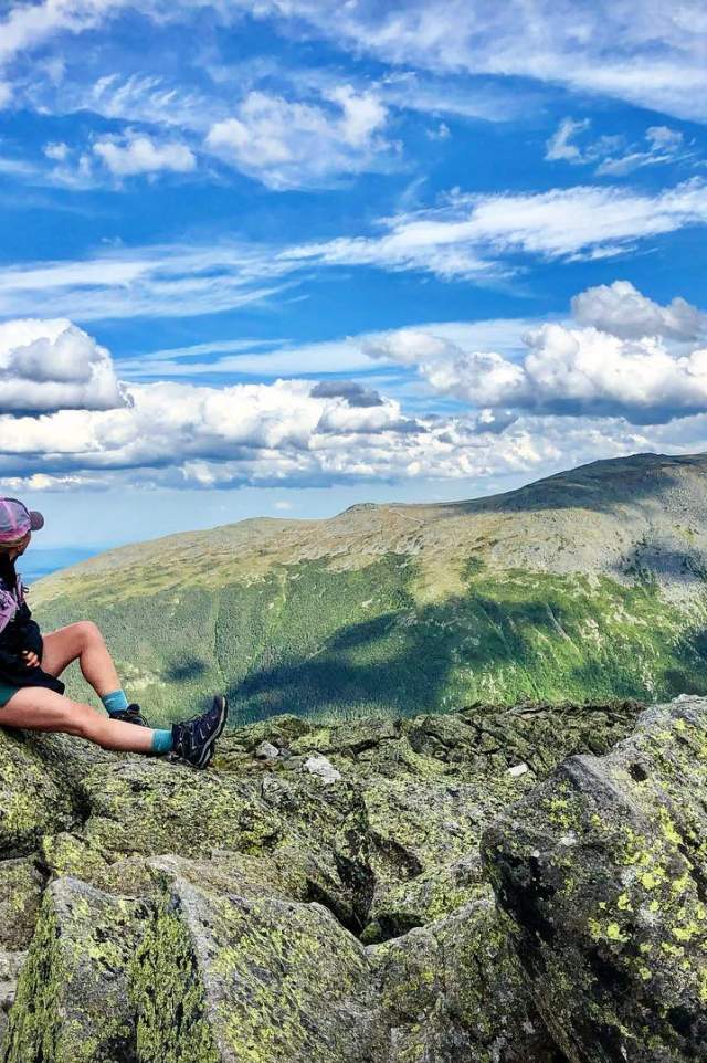 A Hiker On The Summit Of Mount Jefferson In The White Mountains