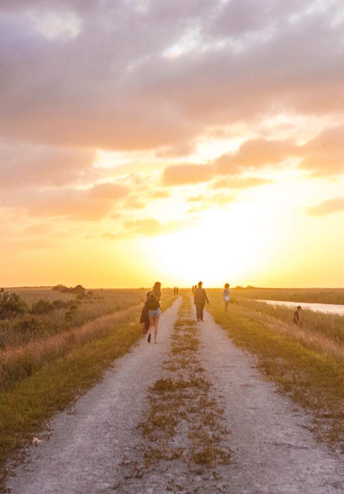 People walking along Atlantic Trailhead path near Coral Springs