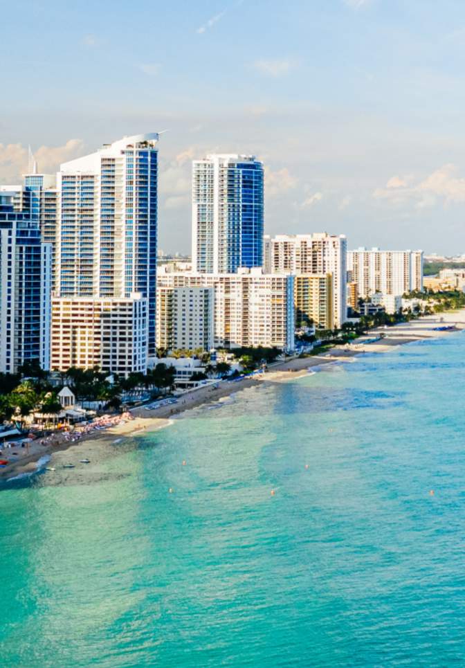 Aerial view of Hallandale Beach and buildings at the shoreline