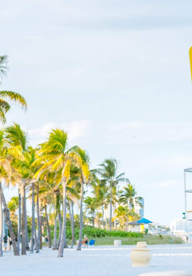 A brightly-colored lifeguard stand watches over the white sands of Hollywood Florida