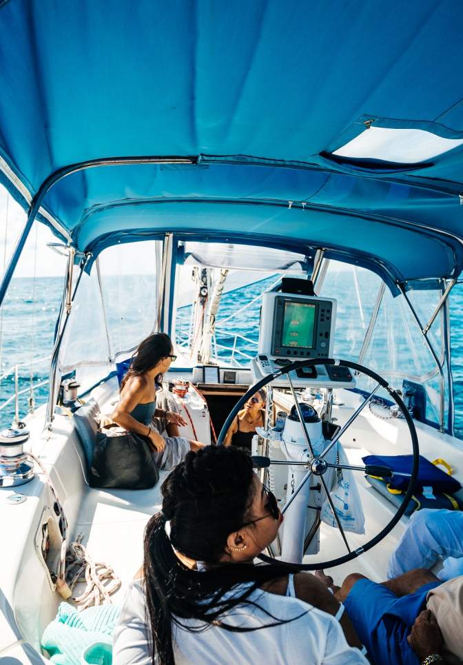 Friends enjoying sailing on the ocean