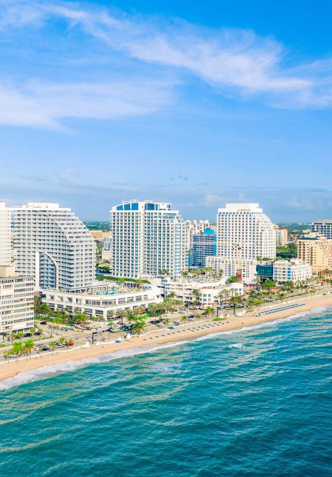 Aerial view of hotels along Fort Lauderdale beach taken from above the ocean to the east