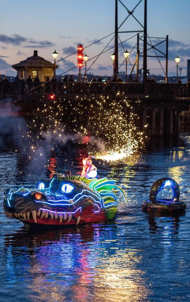 A light up large, puppet on the water