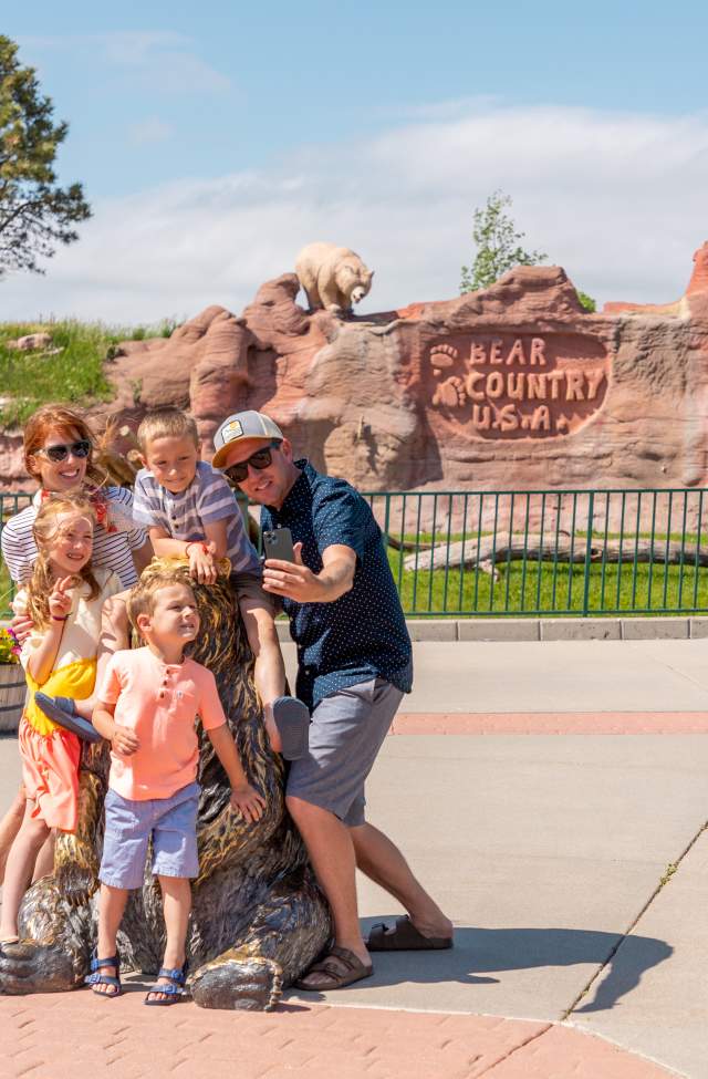 Family posing for a selfie at Bear Country USA in Rapid City, South Dakota