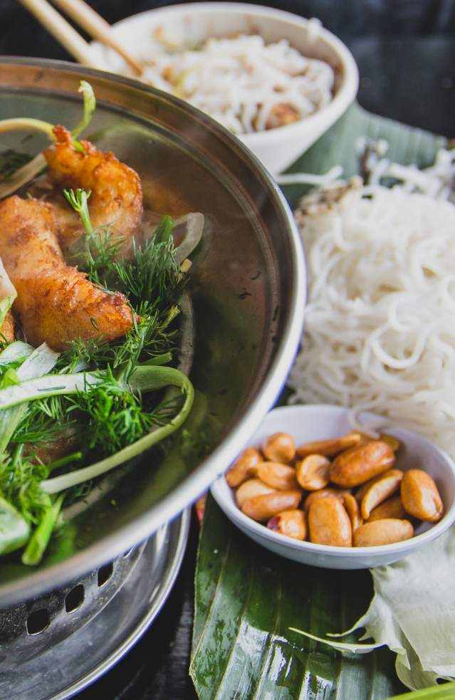 Turmeric and dill fish with herbs, rice noodles and dipping sauce at Hanoi Corner in Anaheim, CA.