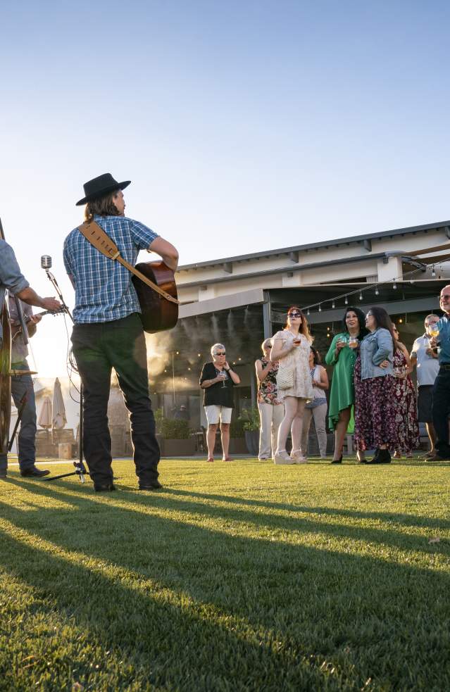 People enjoying live music outdoors