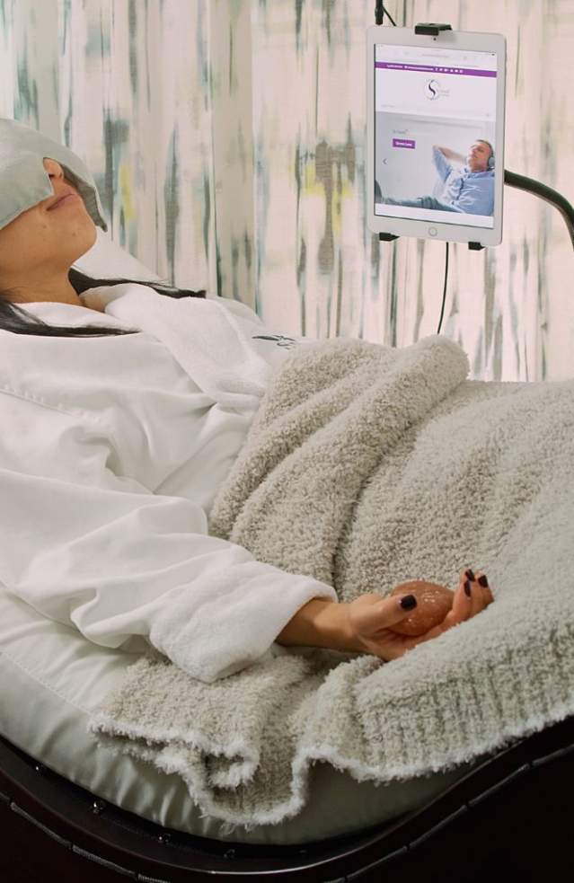 Woman relaxing with sound waves in a Spa