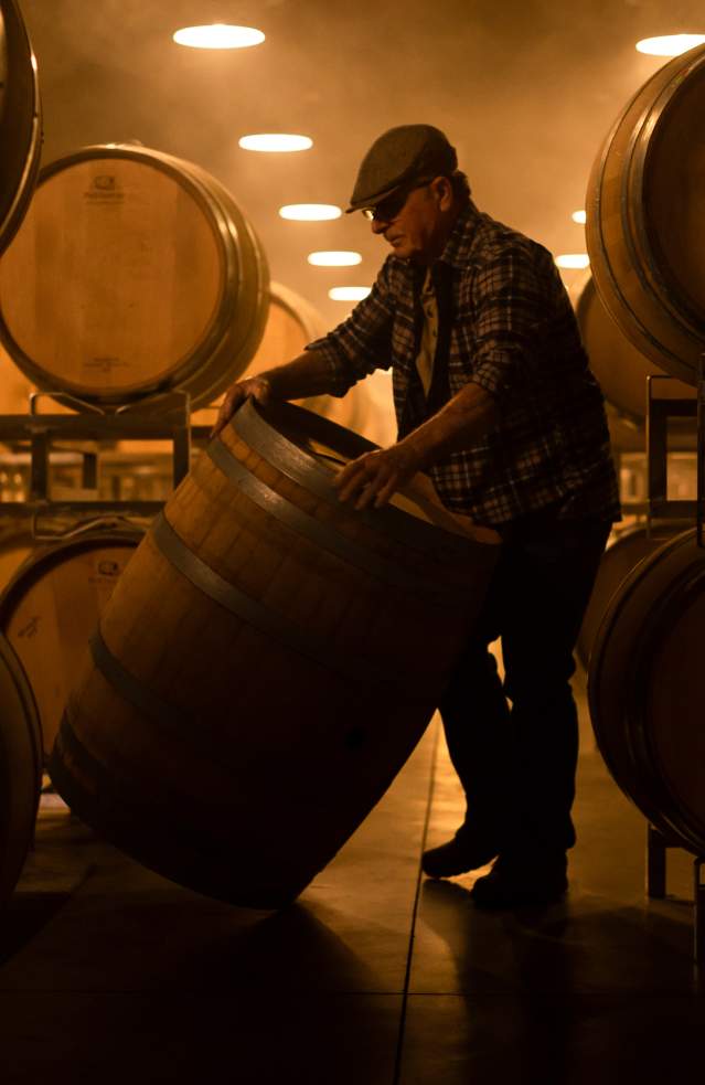 Winemaker and Wine Barrel