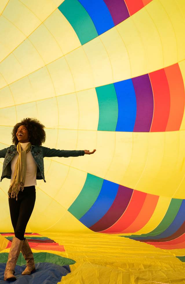 A woman inside of a hot air ballon